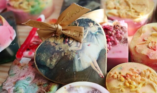 handmade soap, artisan soap, heart ornament, ballerina art, vintage decor, bath products, soap bars, pastel colors, ballet painting, decorative soaps, romantic gift, feminine style, delicate design, soap closeup, handmade gift, retro charm, nostalgic art, ribbon detail, art-inspired decor, bath aesthetics, self-care, elegant packaging, ballet theme, classical painting, heart shaped