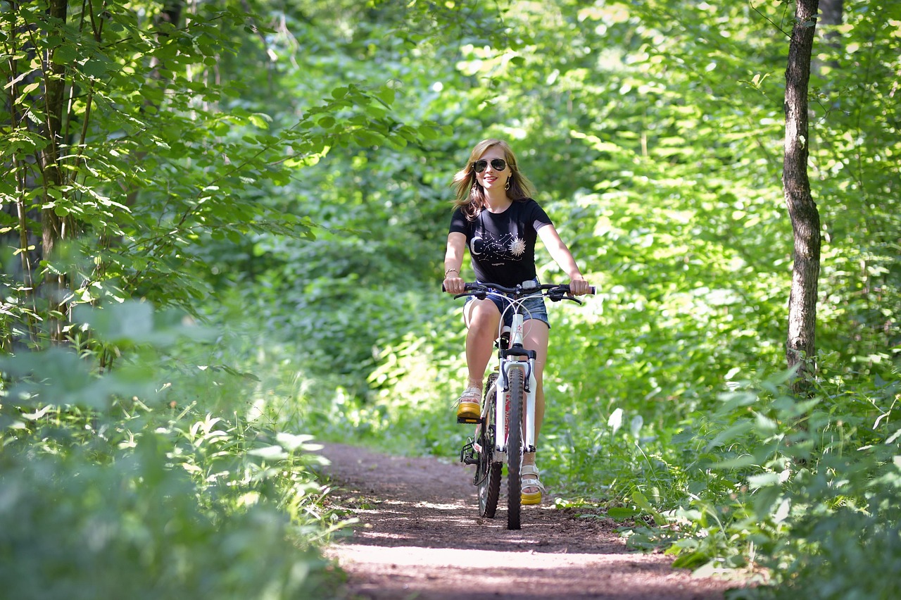 young woman, forest, a ride on the bicycle, bicycle, woman, glade, nature, country road, forest road, dirt road, trees, thicket, edge, bike ride, fitness, to ride a bike